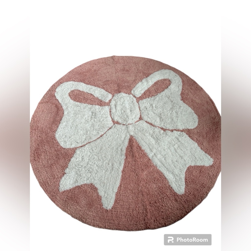 Kitchen or bathroom rug pink with a white bow
